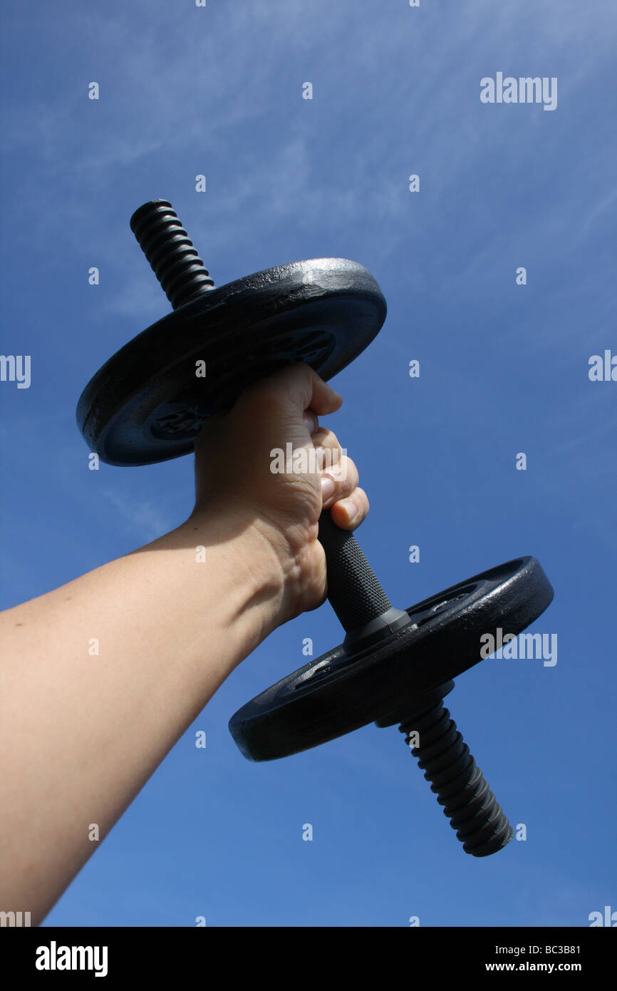 hand holding dumb bell Stock Photo