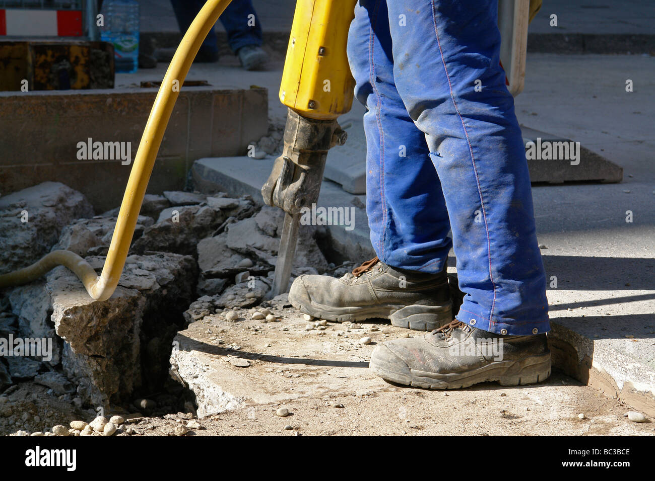 Road worker with pneumatic drill Stock Photo