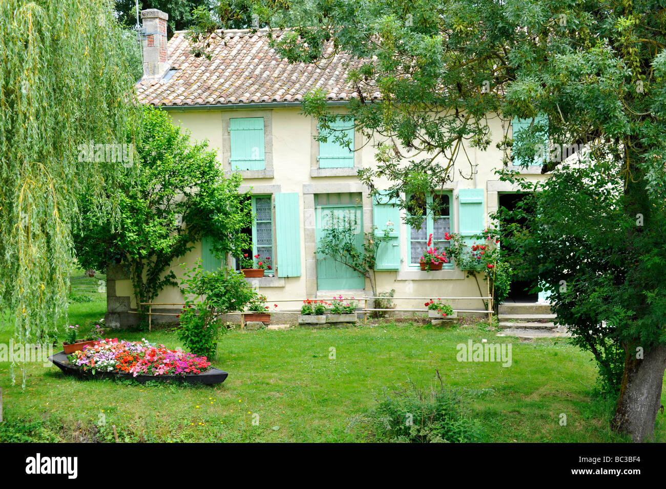 Beautiful old French house on riverbank, in the Marais Poitevin. France