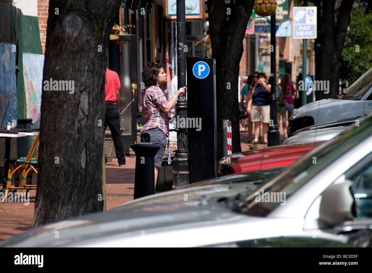 Woman buying parking permit in Baltimore MD USA. Stock Photo