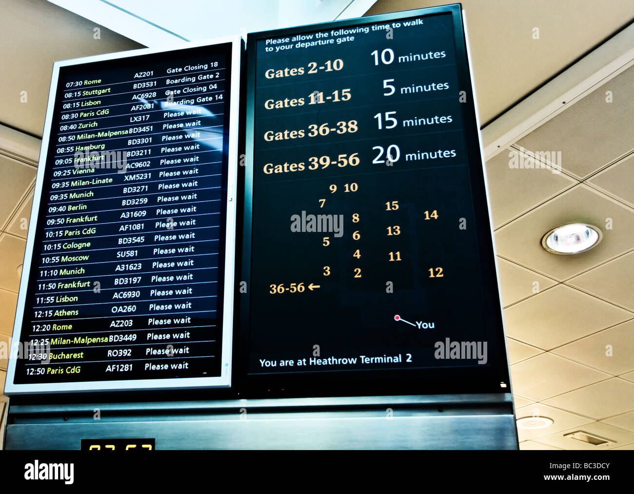 Flight information board at Heathrow Airport, Terminal 2. Stock Photo