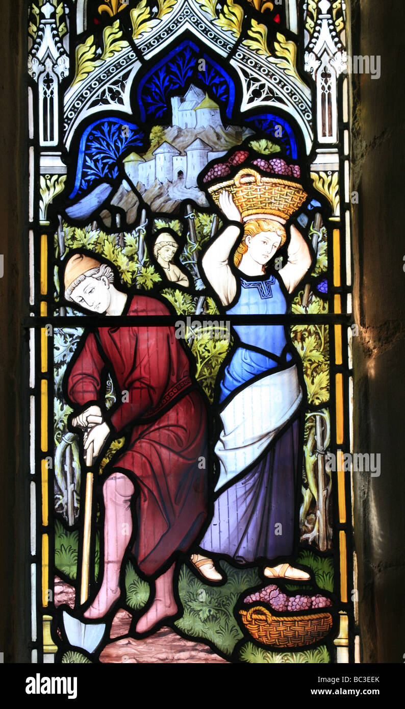 A Stained Glass Window depicting bible story Matthew Chapter 20 Verse 8 Chesterton Church Warwickshire Stock Photo