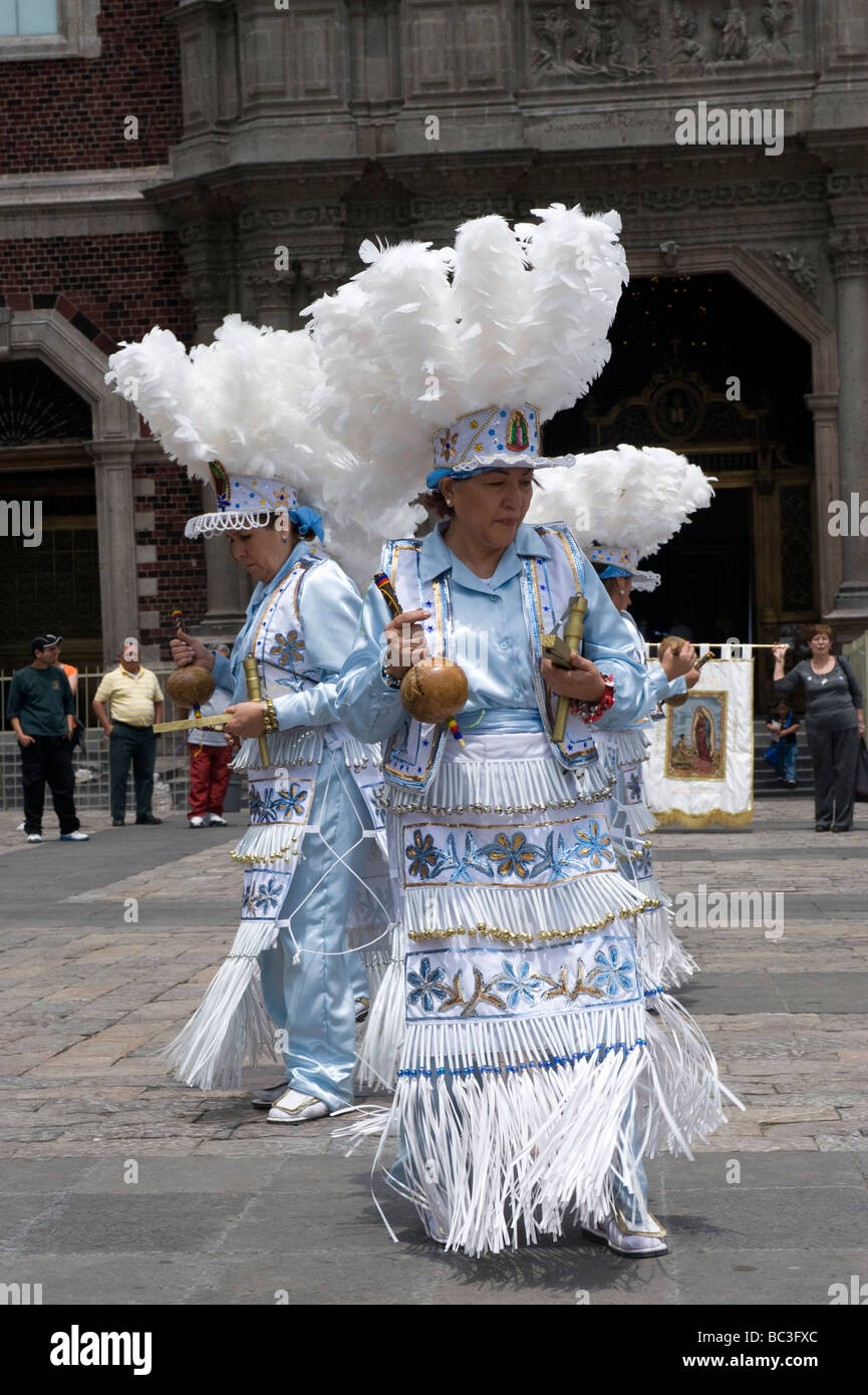 Native mexicans perform a traditional dance in costume at the Basilica of Guadalupe in Mexico City Stock Photo
