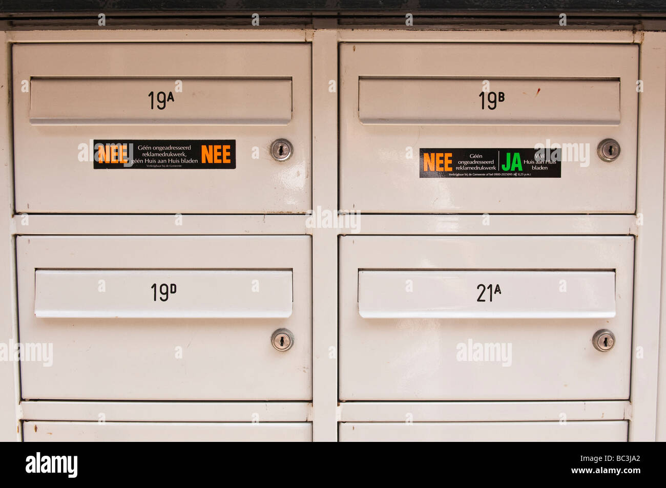 Letterboxes in Amsterdam showing the "Nee/Ya" and "Nee/Nee" stickers to  limit the amount of junk mail received Stock Photo - Alamy