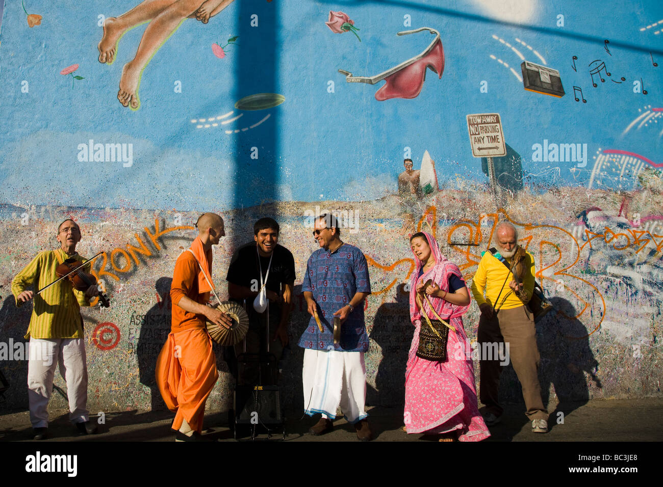 Hare Krishna Devotees playing music and chanting at Venice Beach Los Angeles County California United States of America Mural by R Cronk Stock Photo
