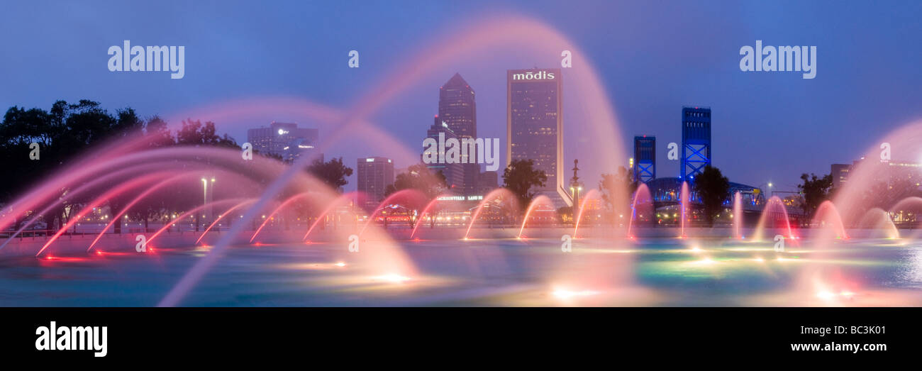 Fountain in downtown Friendship Park frames Jacksonville Florida skyline at dusk Stock Photo