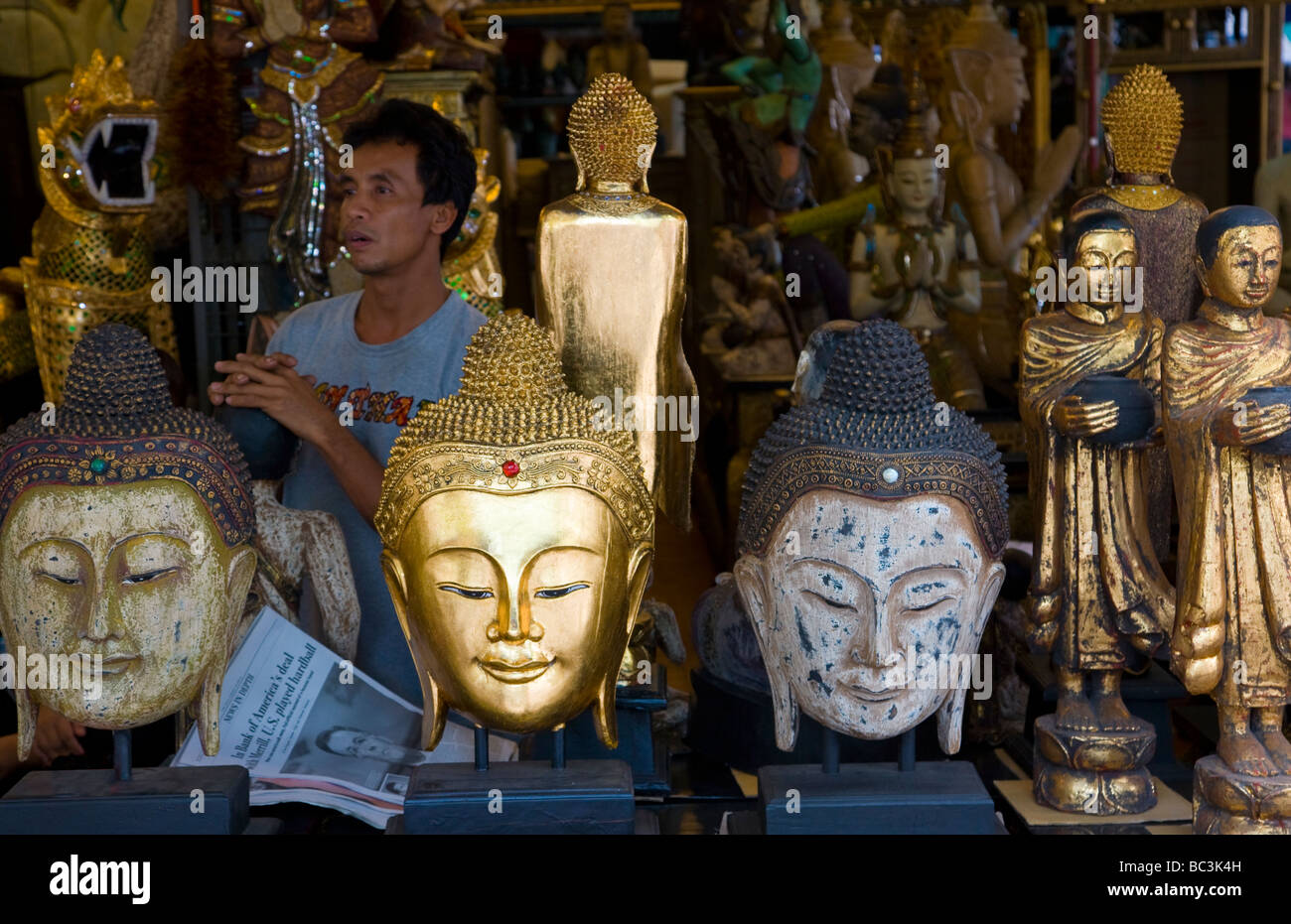 Statues for sale in Thai market Stock Photo Alamy