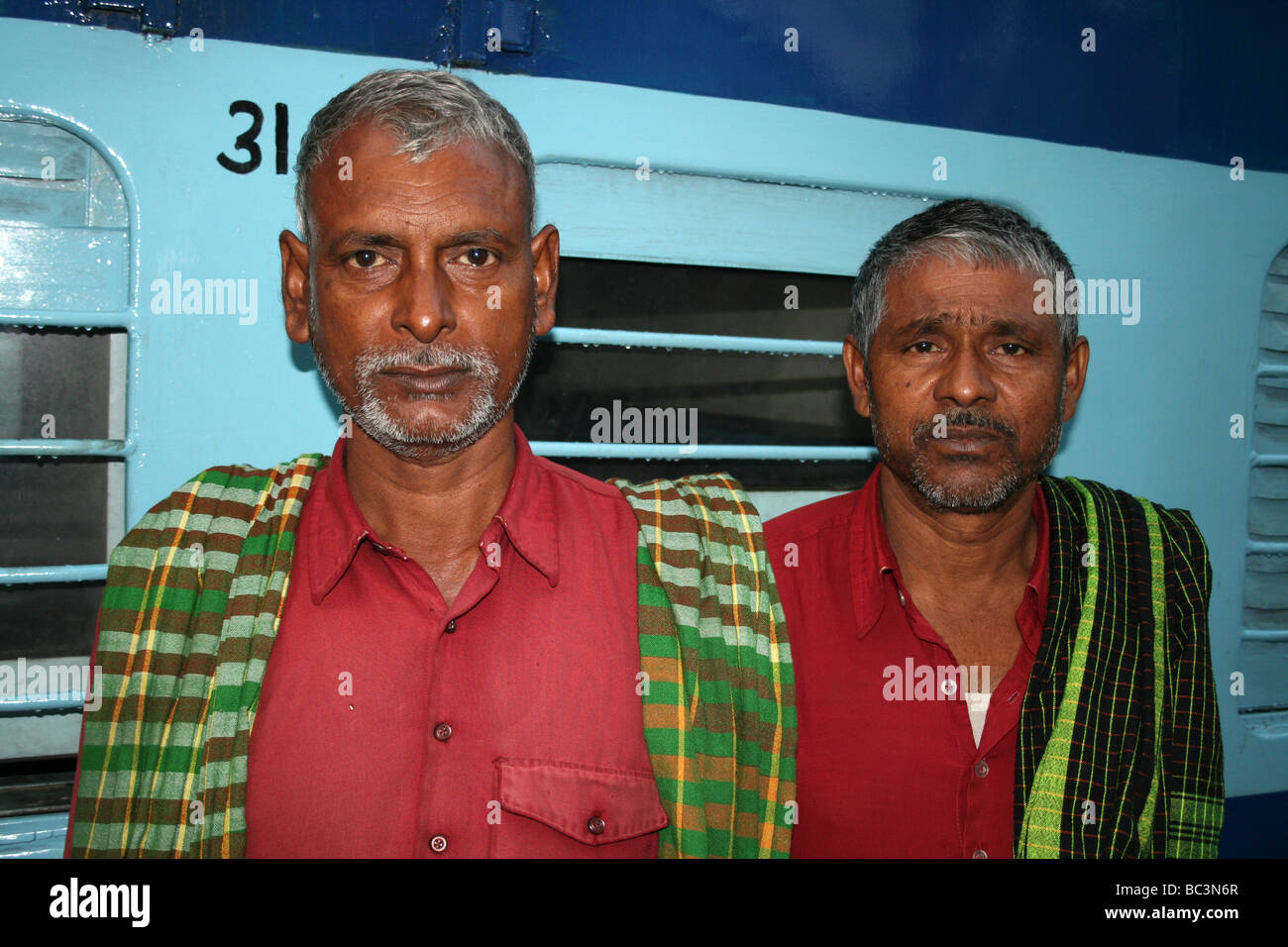 Two Indian Railway Porters, Guwahati, Assam, India Stock Photo