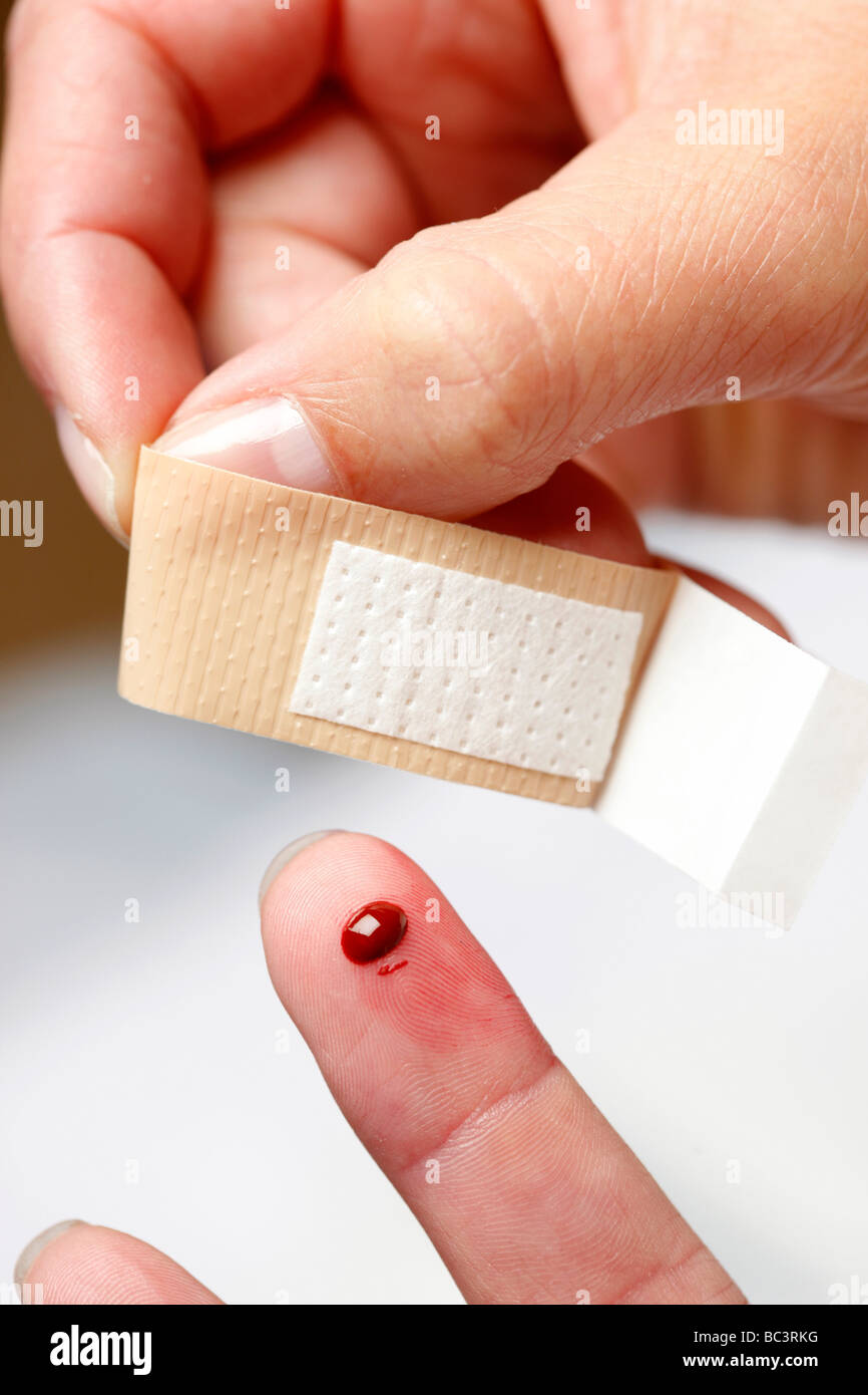 Open Wounded Finger Plaster applyed to a little wound on a finger Stock Photo - Alamy