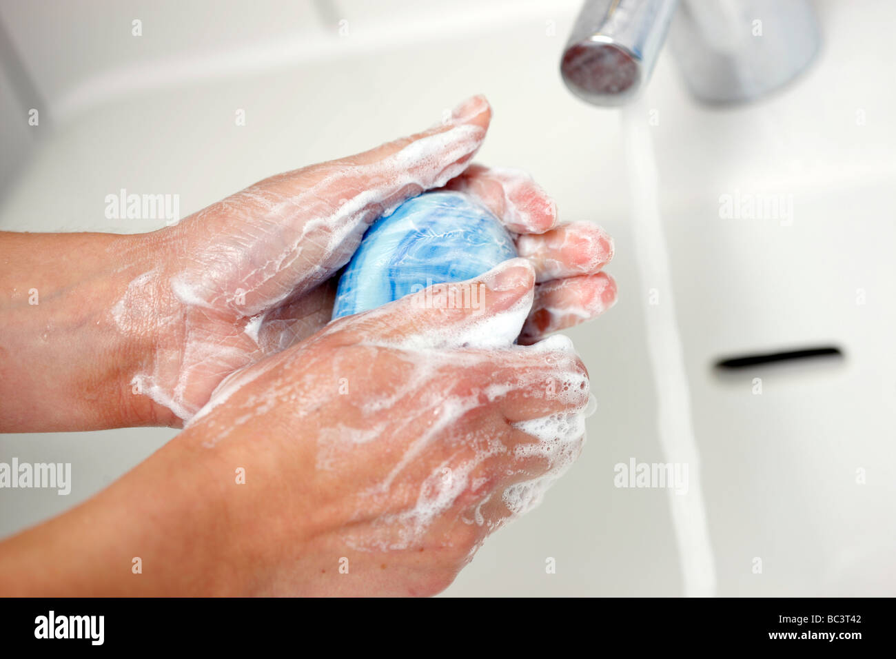 Hand washing with water and soap Stock Photo