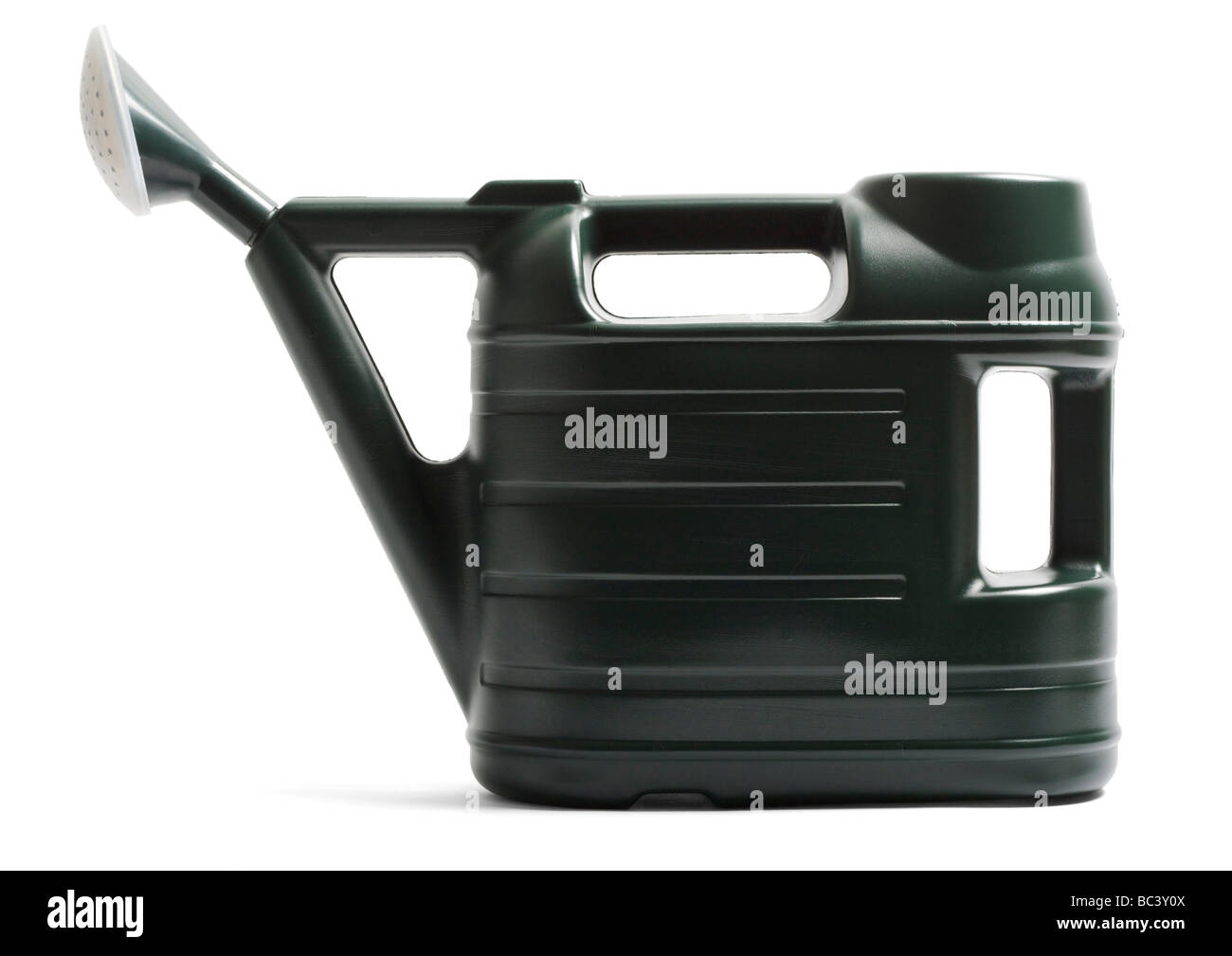 Green plastic watering can on white background Stock Photo