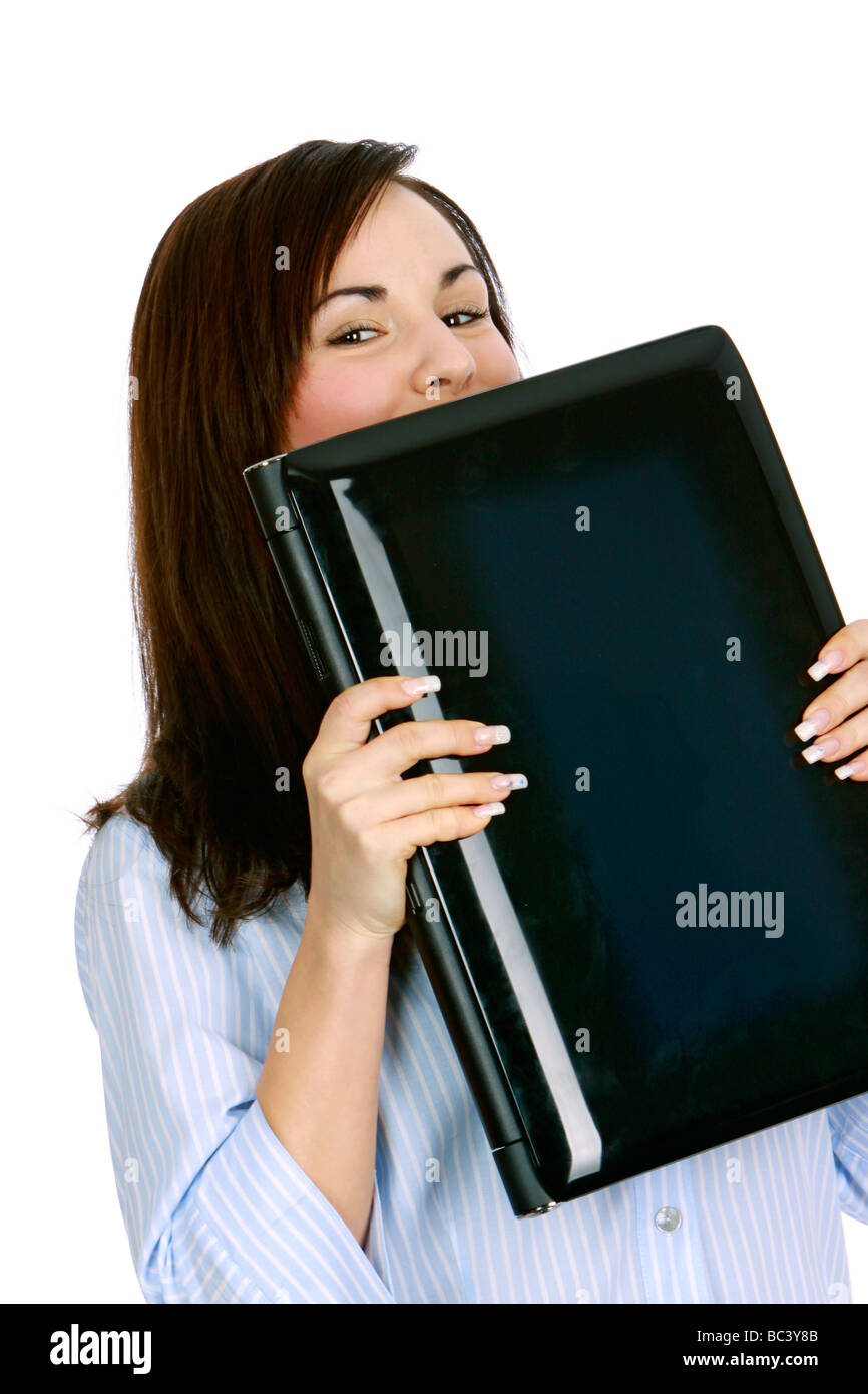 junge Frau kuesst ihr Laptop young woman kissing laptop Stock Photo