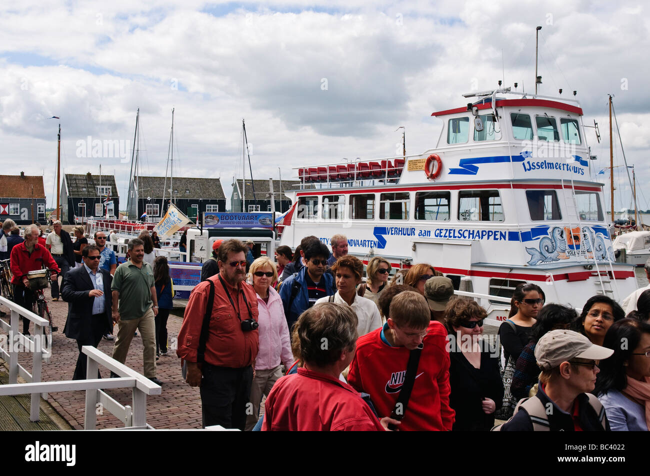 Passengers disembark from ferry from Volendam at Marken Stock Photo