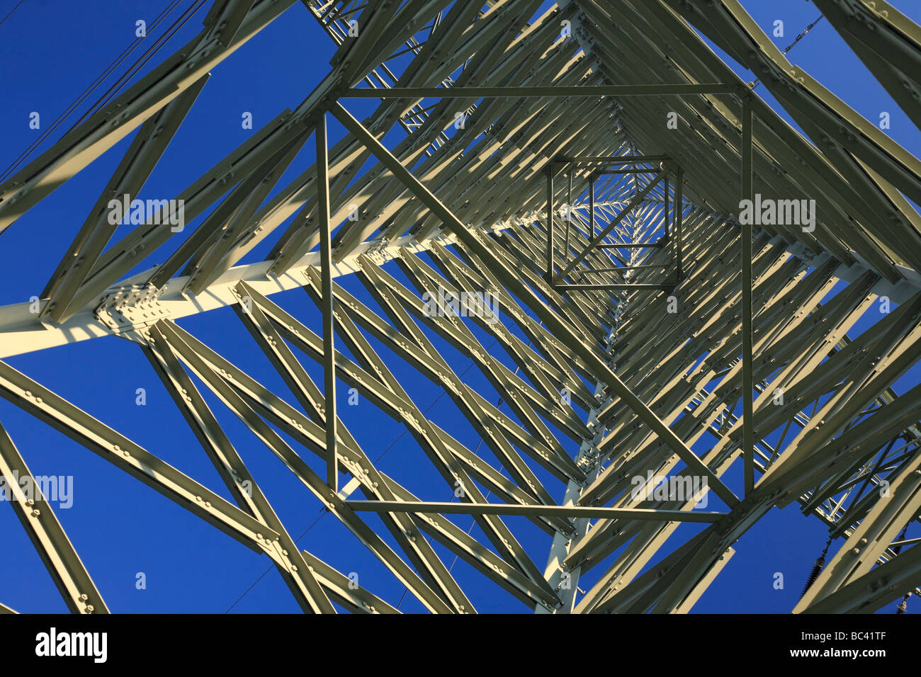 High voltage electricity pylon in Germany from ground perspective - Hochspannungsmast in Deutschland aus der Bodensperspektive Stock Photo