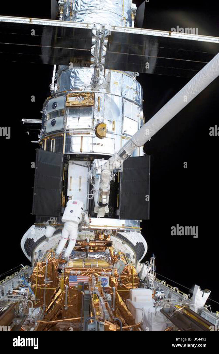 NASA astronauts working on the Hubble Telescope in space Stock Photo