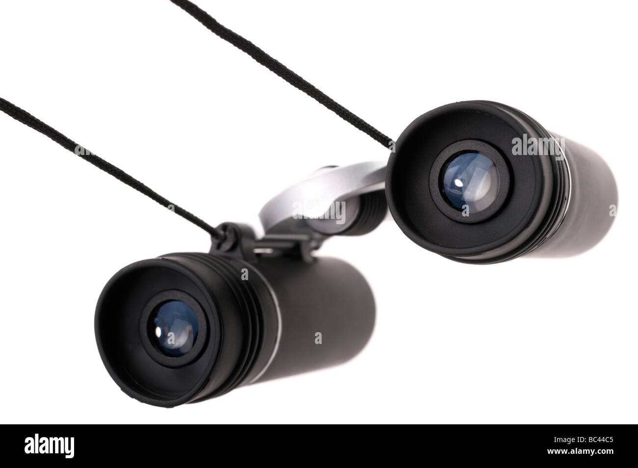 A pair of small black binoculars and neckstrap Stock Photo Alamy