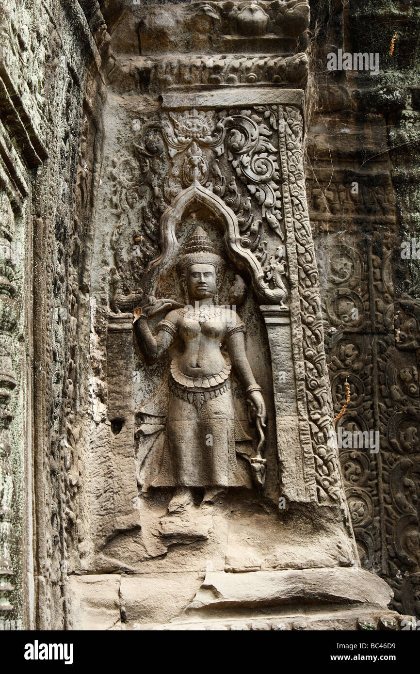 Devata carving on stone wall of 'Ta Prohm' temple ruins, Angkor, Cambodia Stock Photo