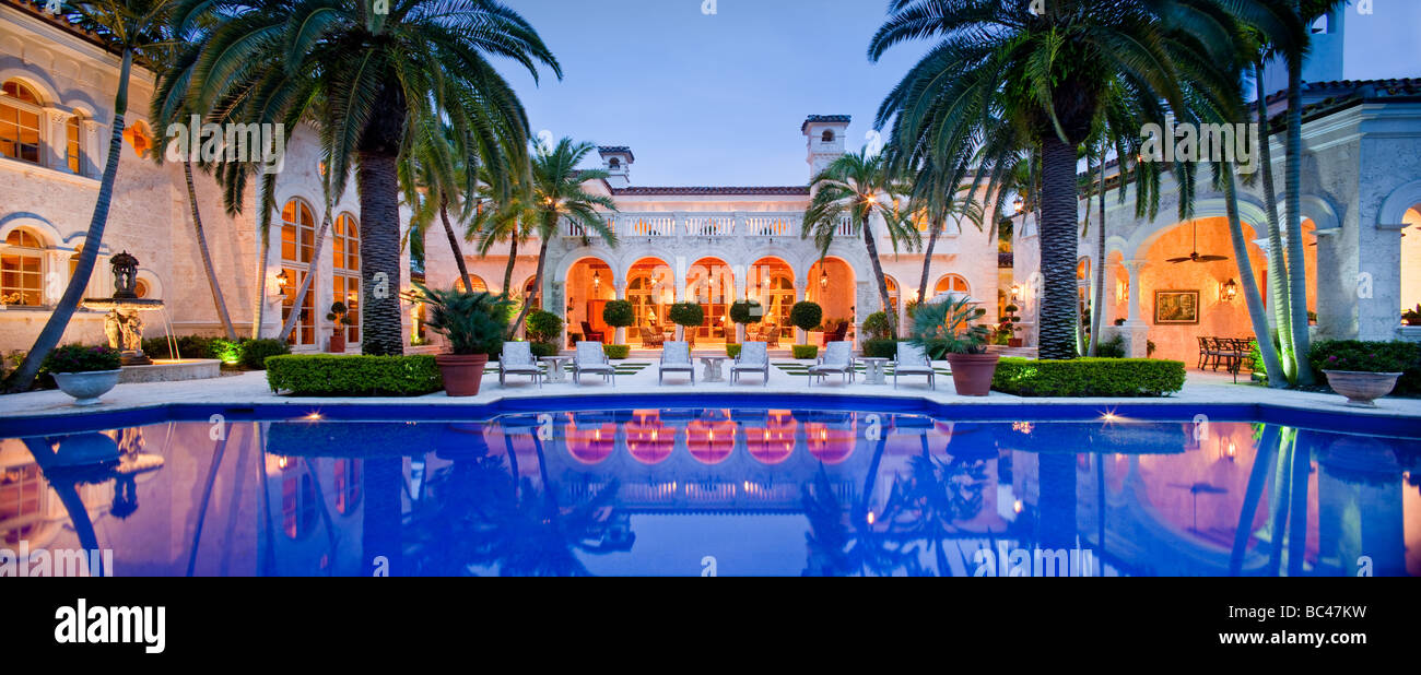 A panoramic image of the pool area of a large mansion in Boca Raton, Florida Stock Photo