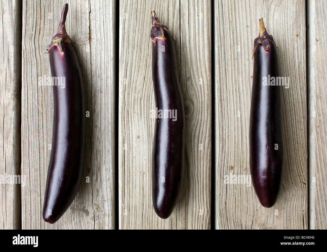 Three ichiban, or Japanese, eggplants Stock Photo Alamy