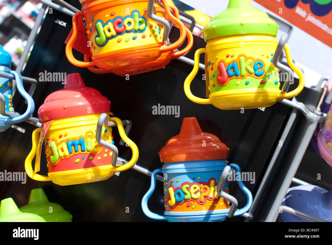 Baby trainer cups displaying names Stock Photo