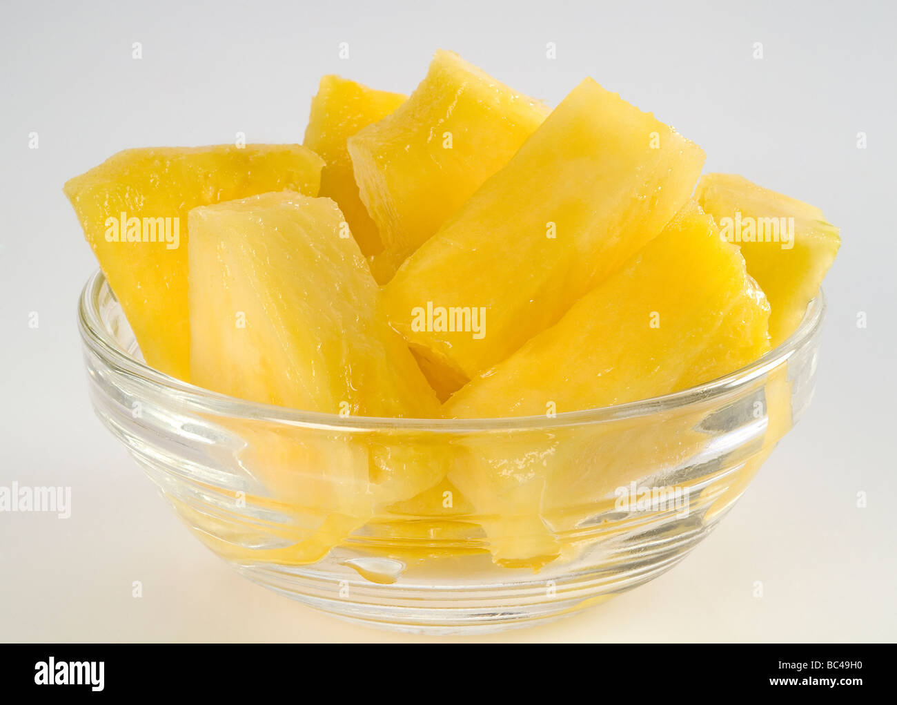 Pineapple chunks in a glass bowl Stock Photo Alamy