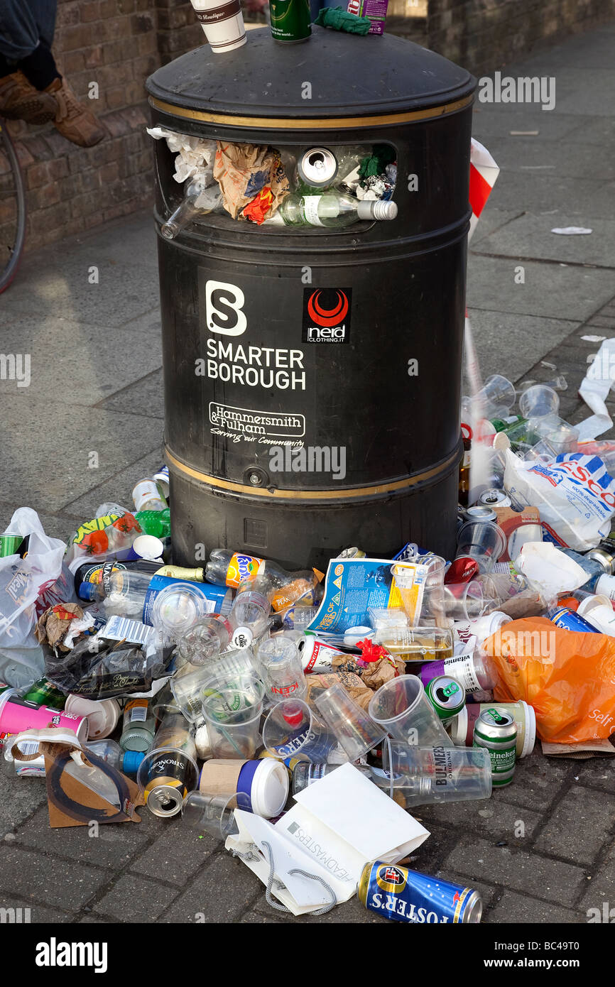 Overflowing rubbish bin in London UK Stock Photo - Alamy