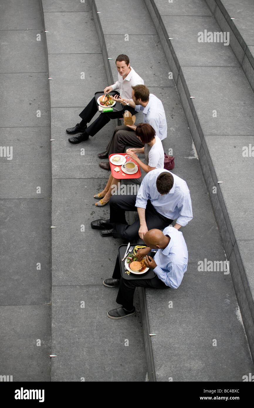 Colleagues eat their lunch together at More London Riverside. Stock Photo