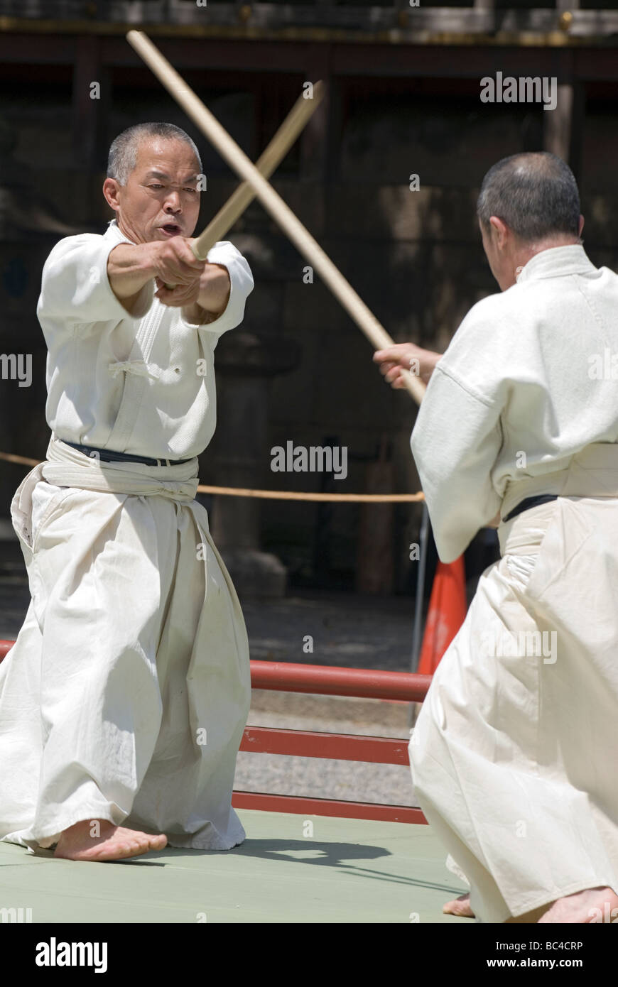 two men sparring with Filipino stick fighting martial arts Stock Photo