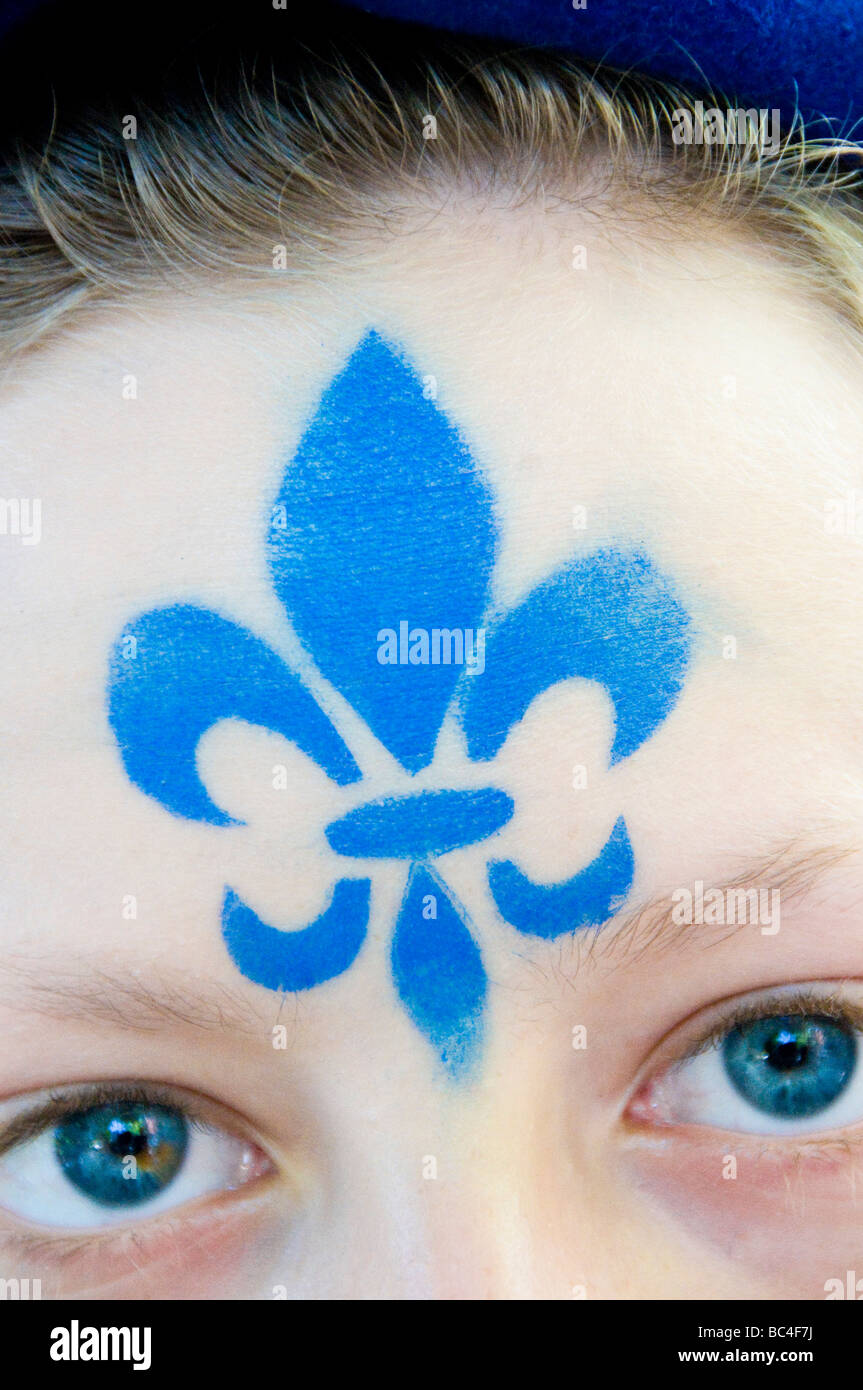 Fleur de lys symbol of the province of quebec on a face during the Saint Jean baptiste parade Montreal- Stock Photo