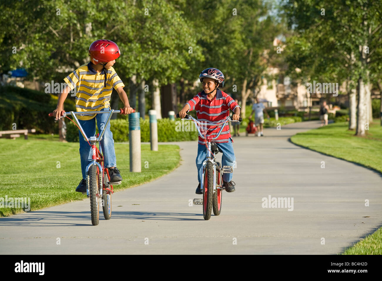 child boys Brothers bike riding bicycles bicycle bikes together outside