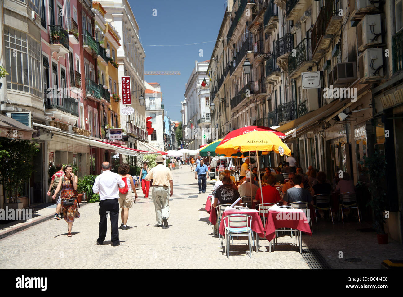 Street with cafes in the Baixa district of Lisbon Stock Photo