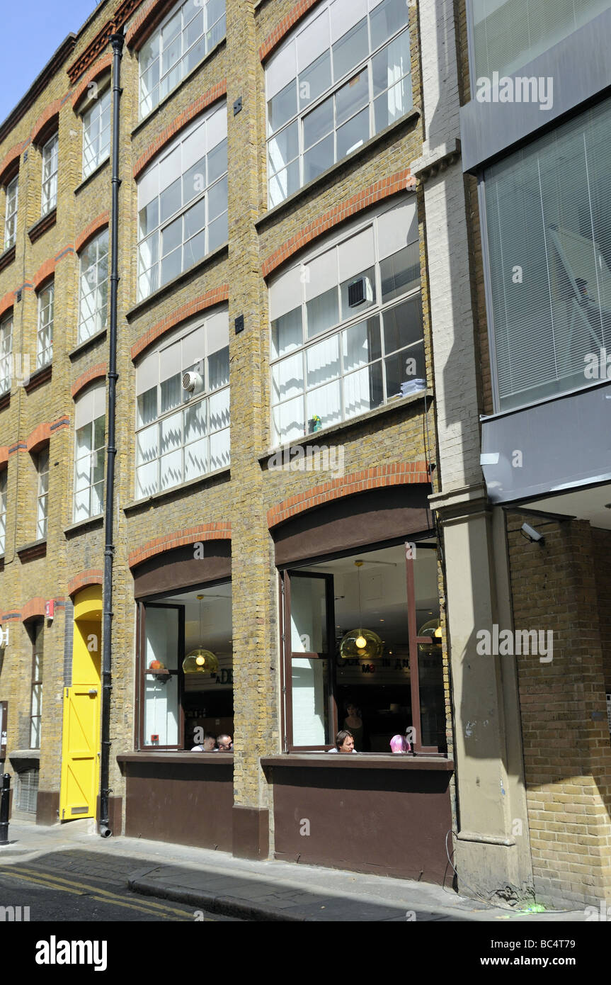 Cafe in converted warehouse building Hoxton Hackney London England UK Stock Photo