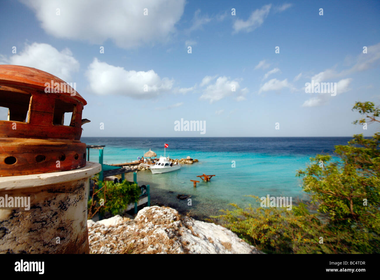 View over the ocean from the Caribbean isle Curacao in the Netherlands Antilles. Model lighthouse and blue sea are visible Stock Photo