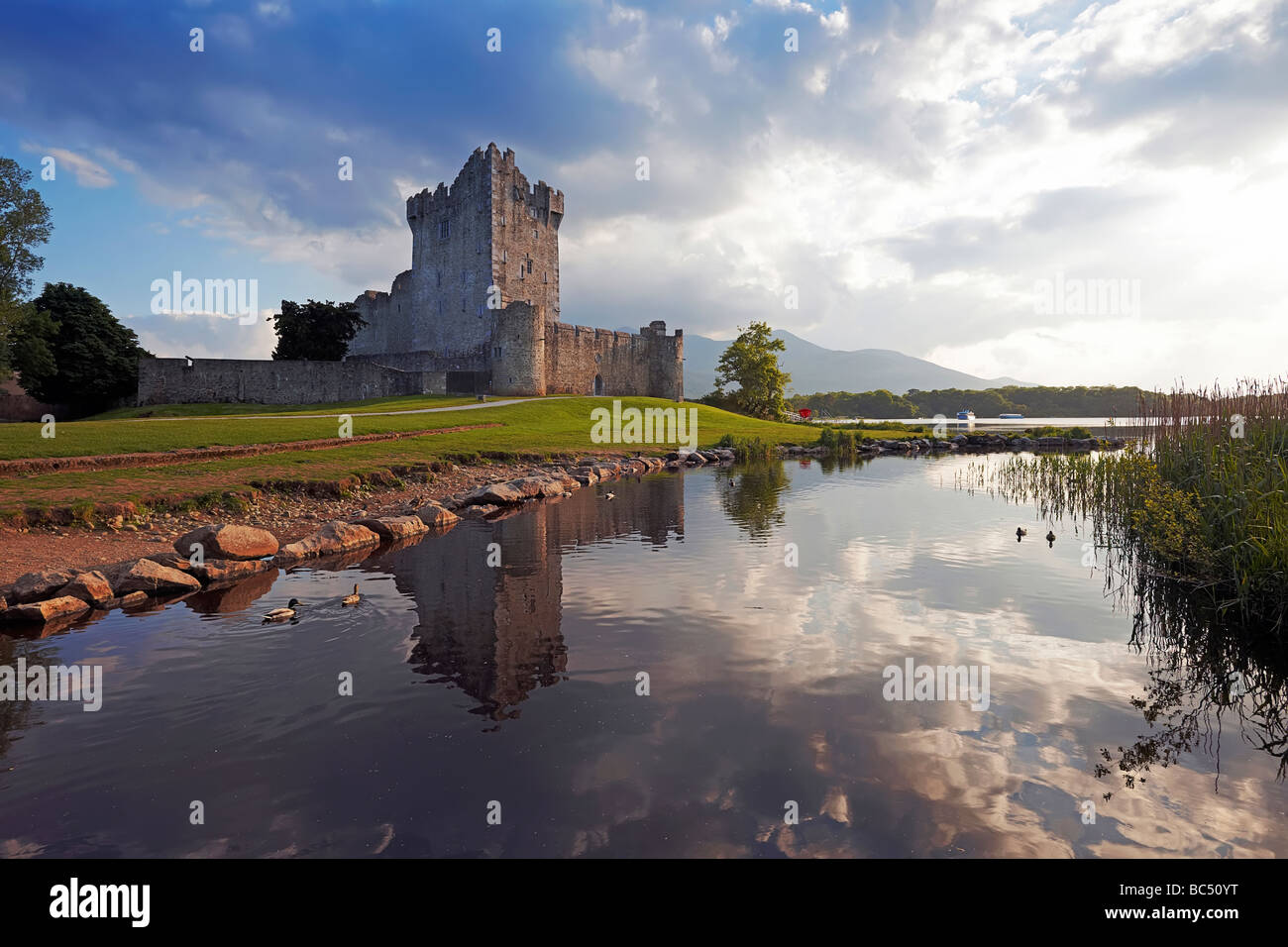 Ross Castle reflected in Lough Leane at Killarney Co Kerry Ireland Stock Photo