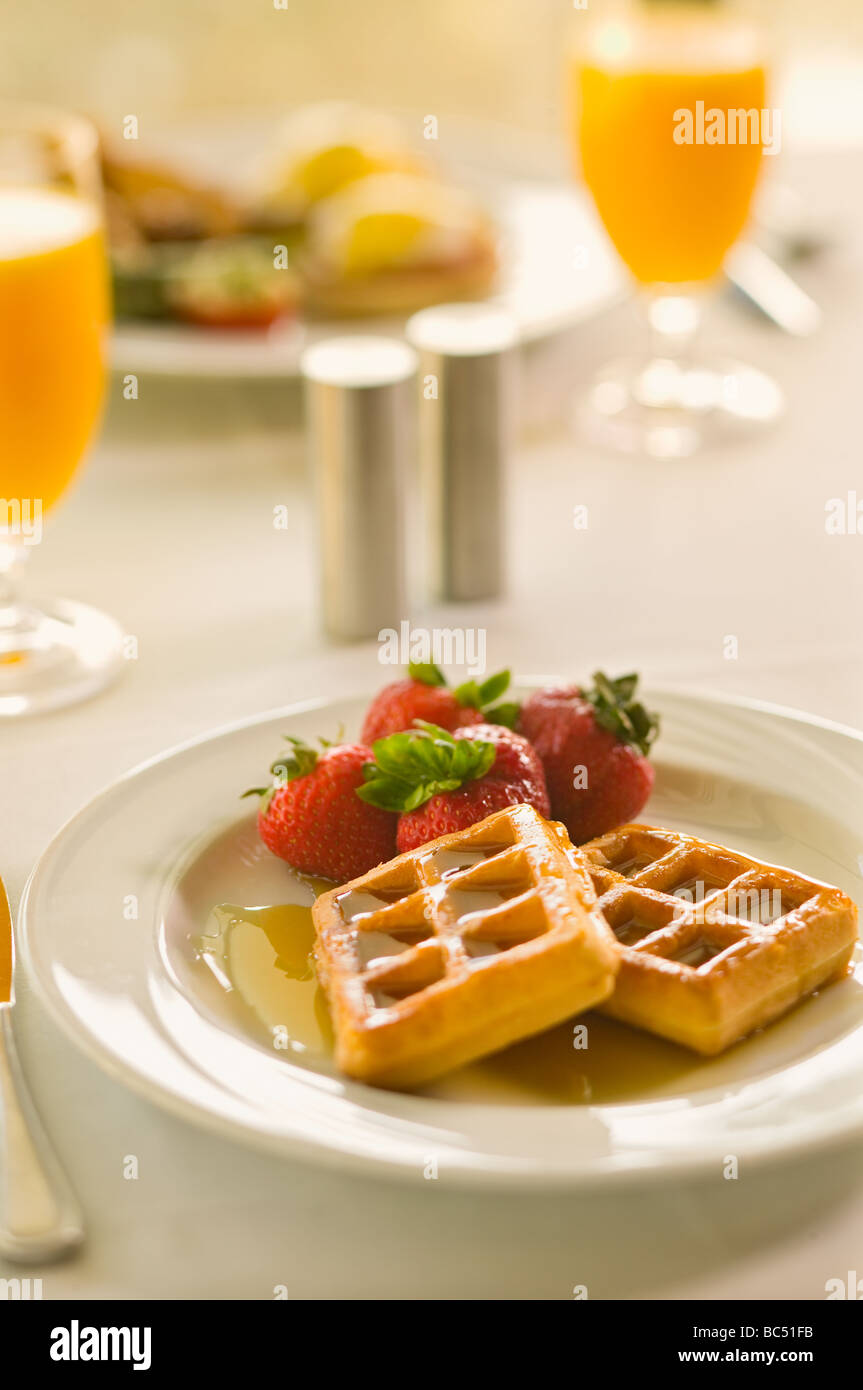 Waffle breakfast at a restaurant table Stock Photo Alamy