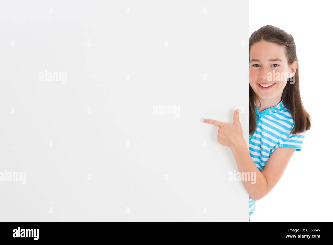 Cute Caucasian girl holding a blank sign Stock Photo