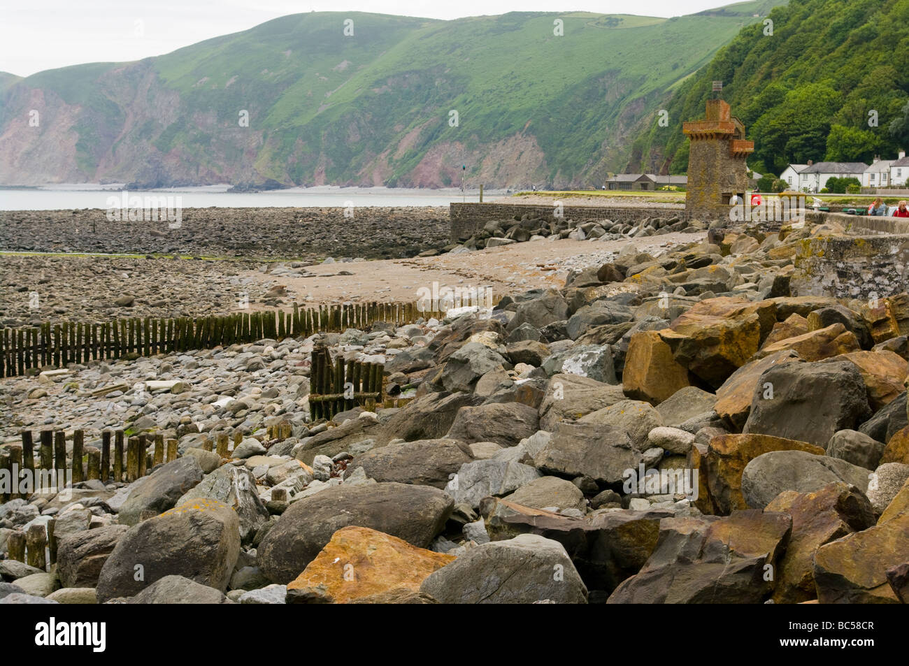 Lynmouth Rock Strewn Seafront and The Overlooking Hillsides North Devon England Stock Photo