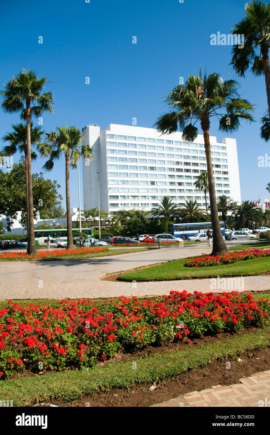 park flowers casablanca morocco city skyscraper tall buildings people commuter morning rush hour cars downtown offices africa pl Stock Photo