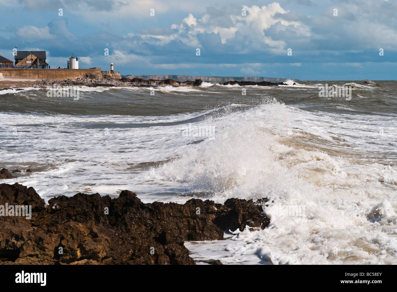 Waves breaking on the shore at Porthcawl, South Wales. Stock Photo