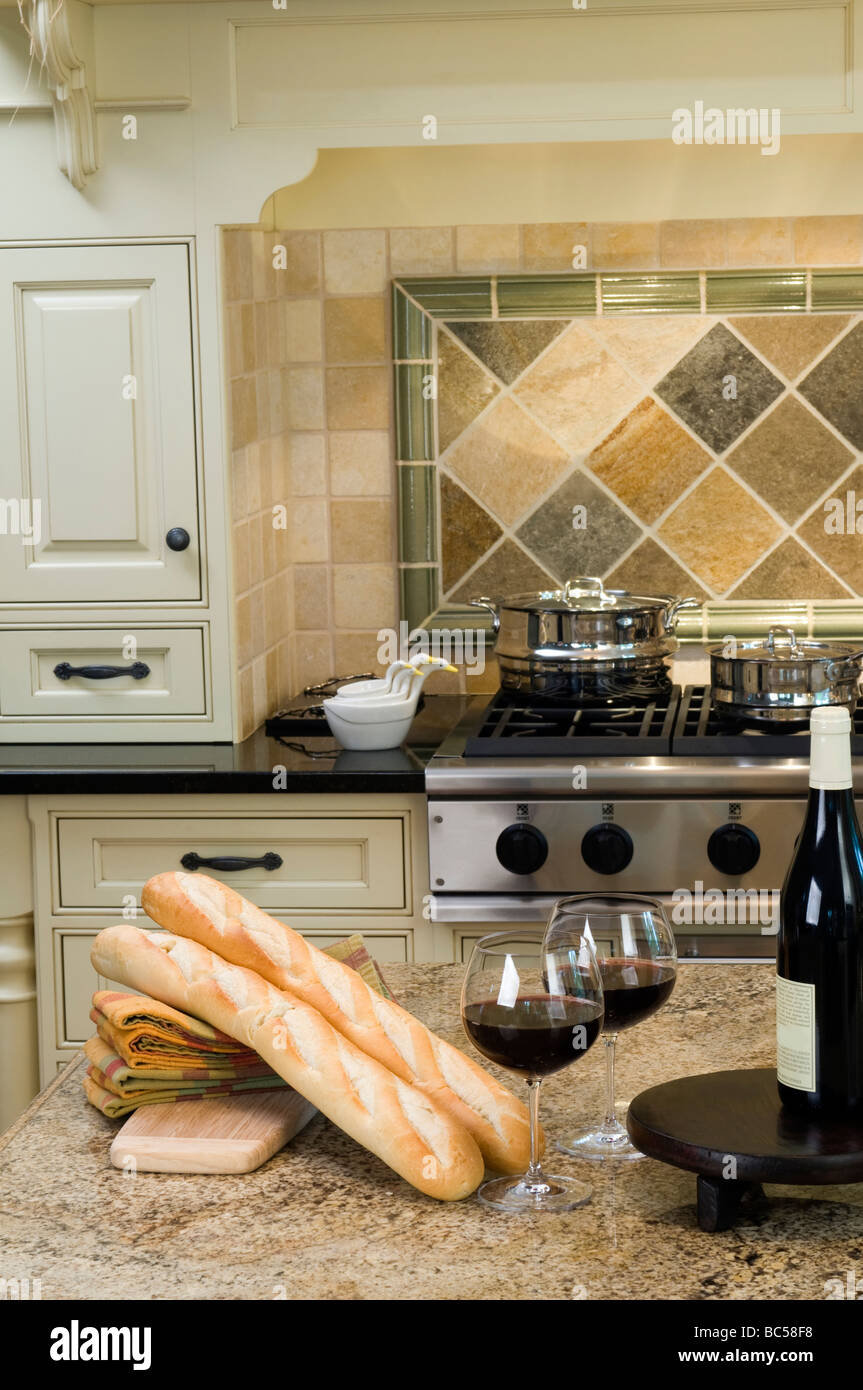 luxury home modern custom kitchen with wine and baguettes on center ...