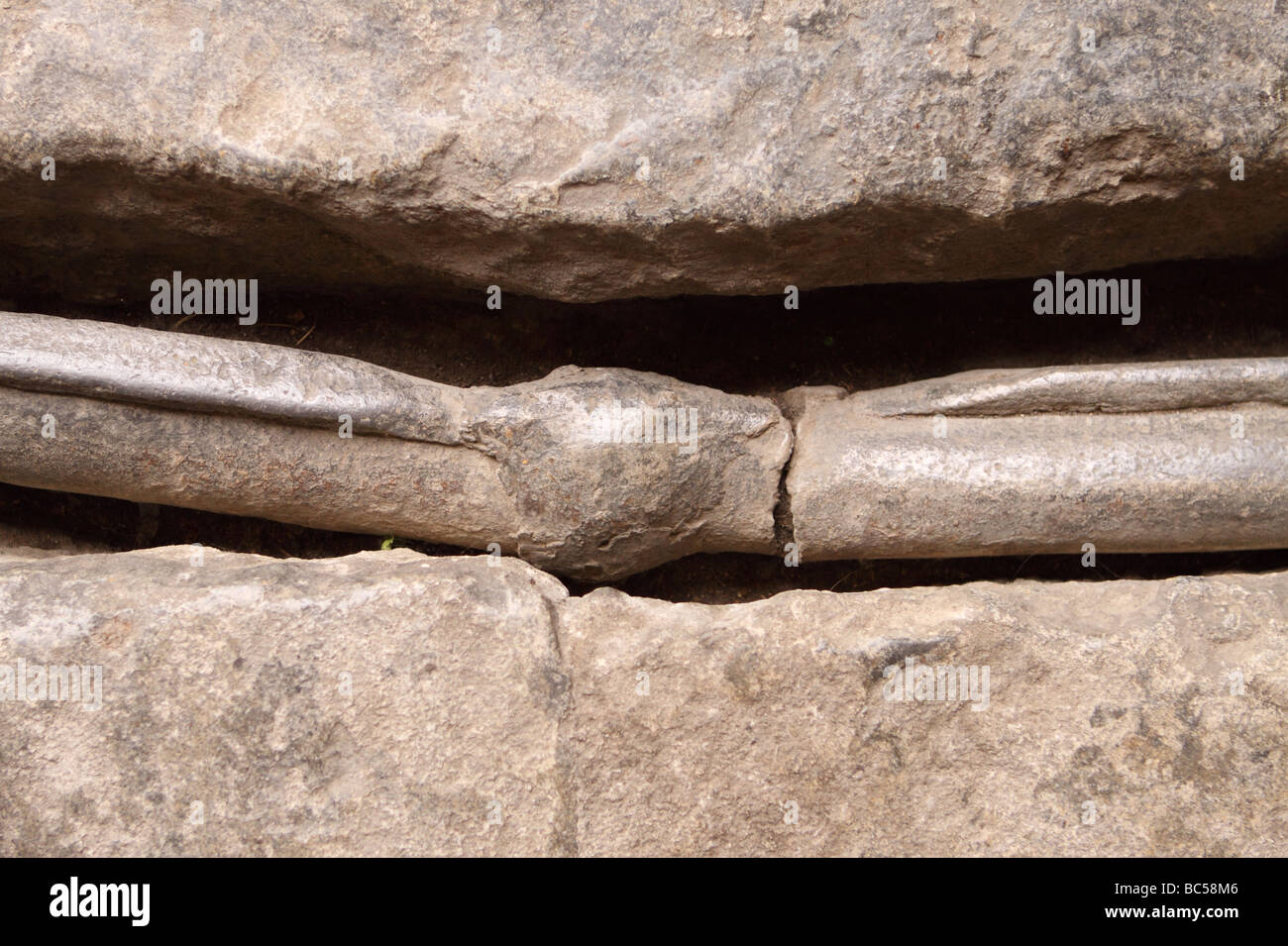 Bath England Roman lead pipe set into the limestone floor of the Roman Baths beside the main spa pool Stock Photo