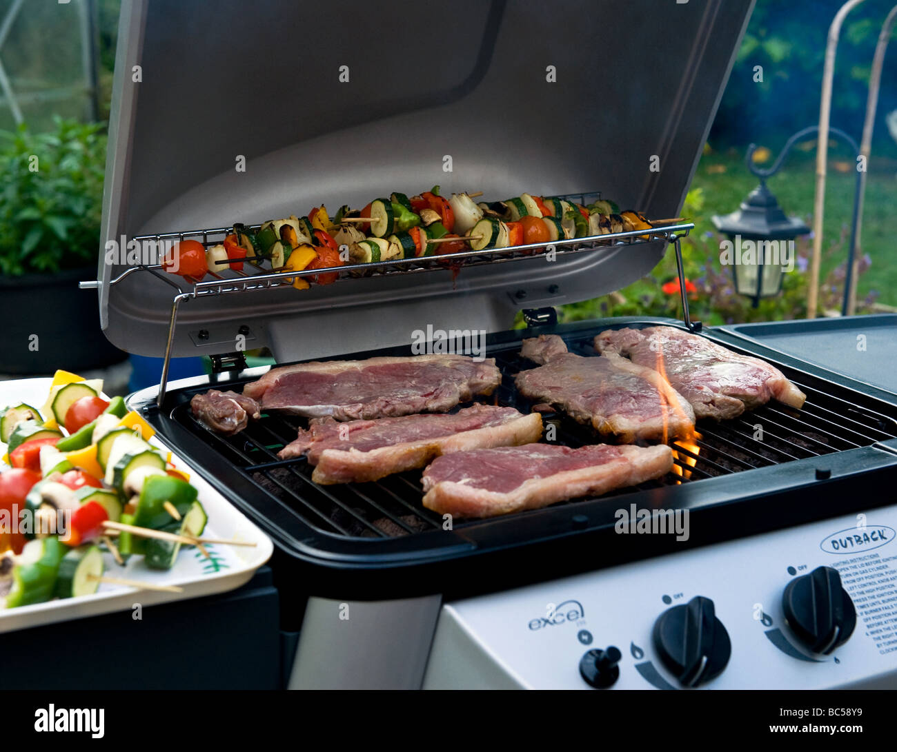 Sirloin Steaks Cooking On A Barbecue Stock Photo Alamy
