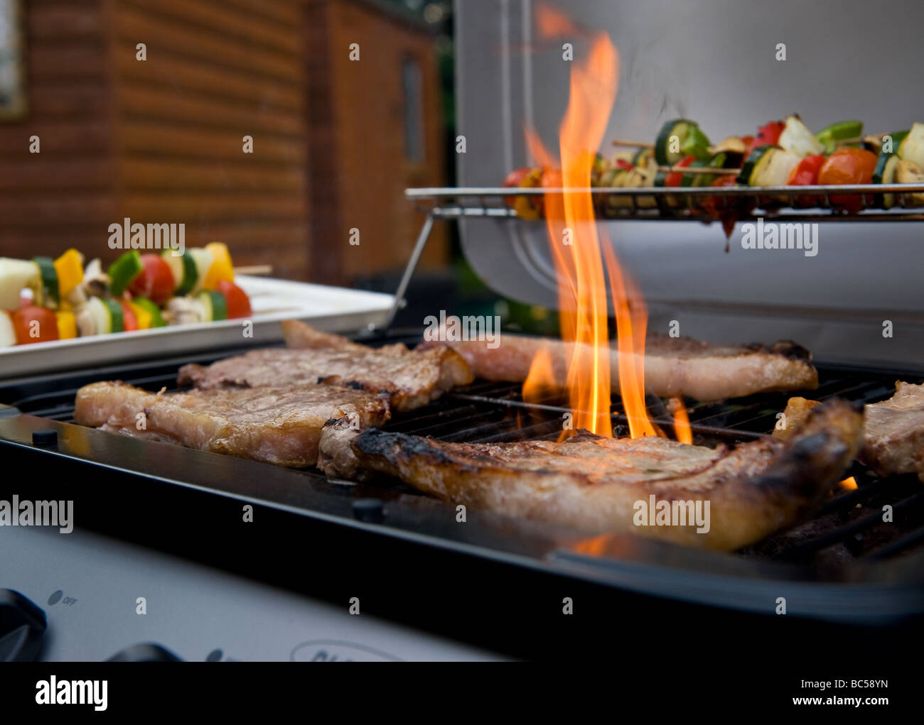 Sirloin Steaks Cooking On A Barbecue Stock Photo Alamy