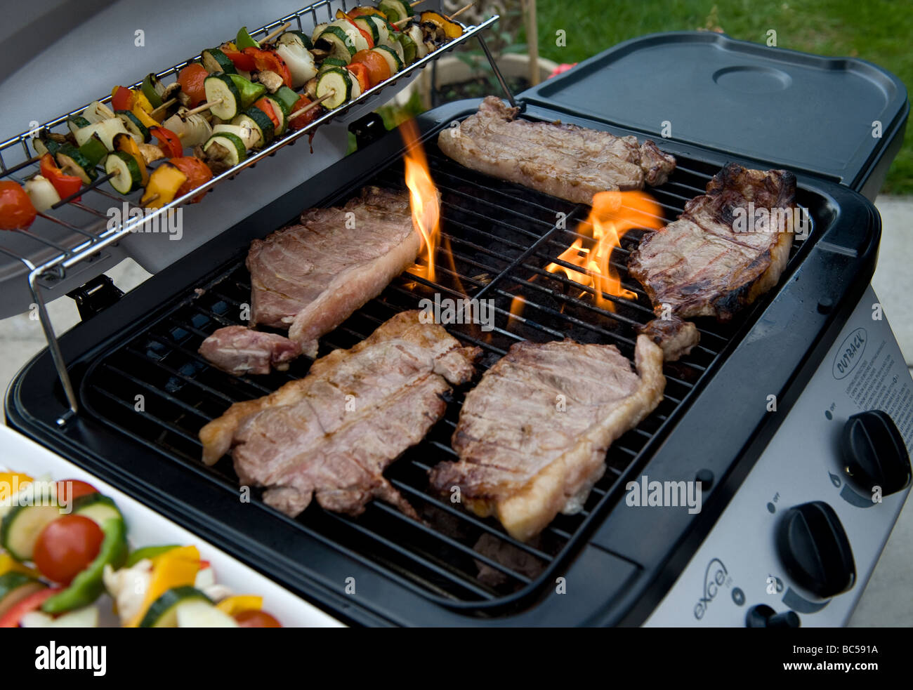 Sirloin Steaks Cooking On A Barbecue Stock Photo Alamy