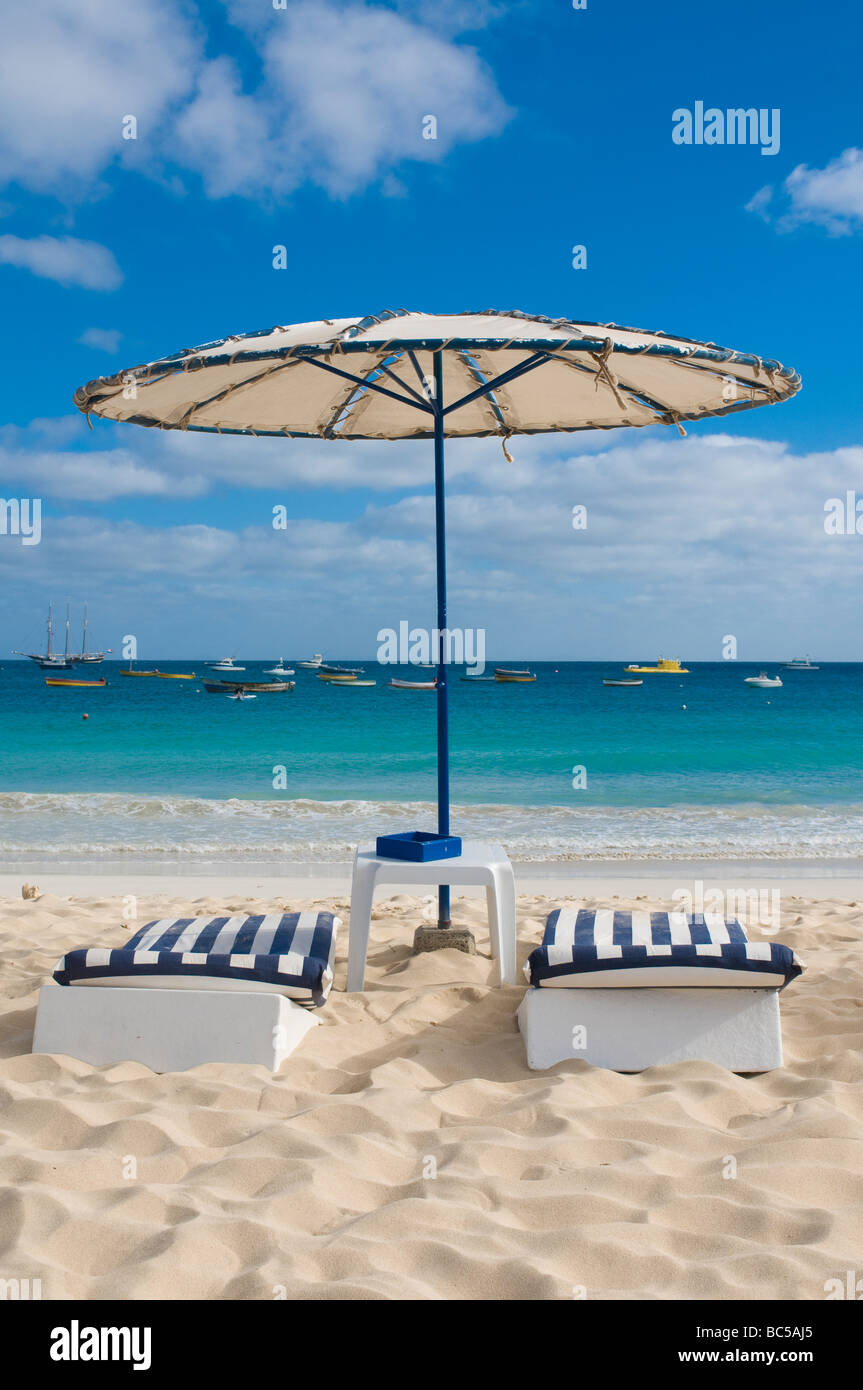 Nice deck chairs and sunshade at sandbeach Santa Maria Sal Cabo Verde Africa Stock Photo