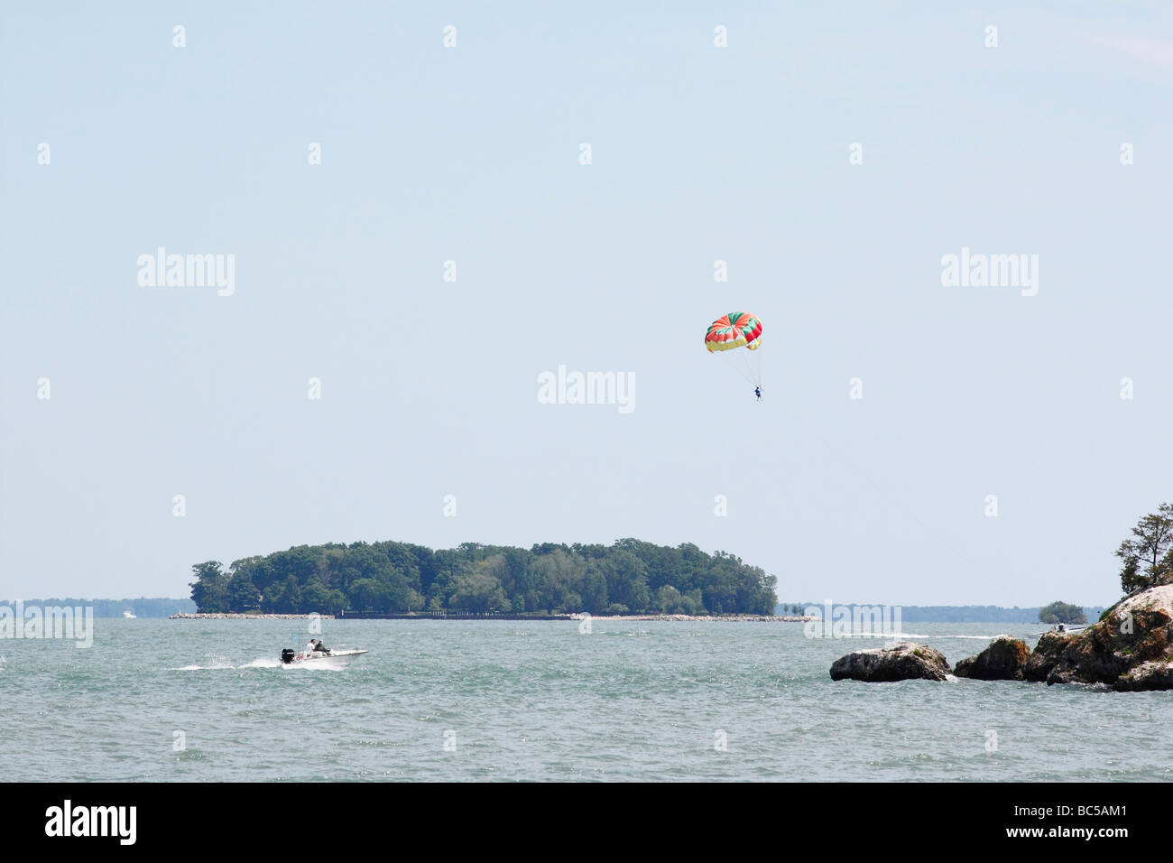 Parasailing  on Lake Erie island Put in Bay landscape outside horizon water sports in Ohio USA US daily life lifestyle living photography scene hi-res Stock Photo