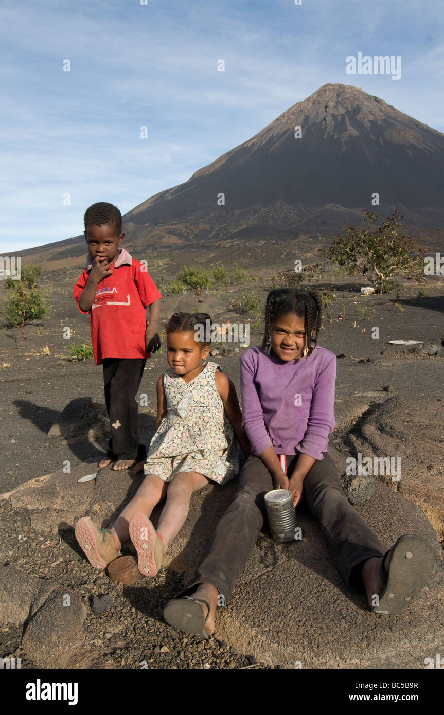 Smiling children in front of vulcano on Fogo Cabo Verde Africa Stock Photo