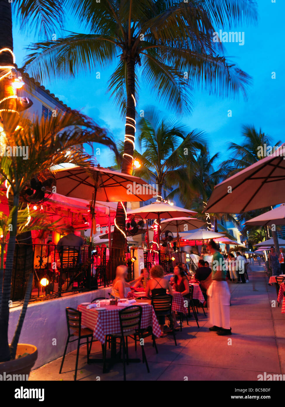cafes and restaurants at dusk on Ocean Drive in South Beach Miami Stock Photo