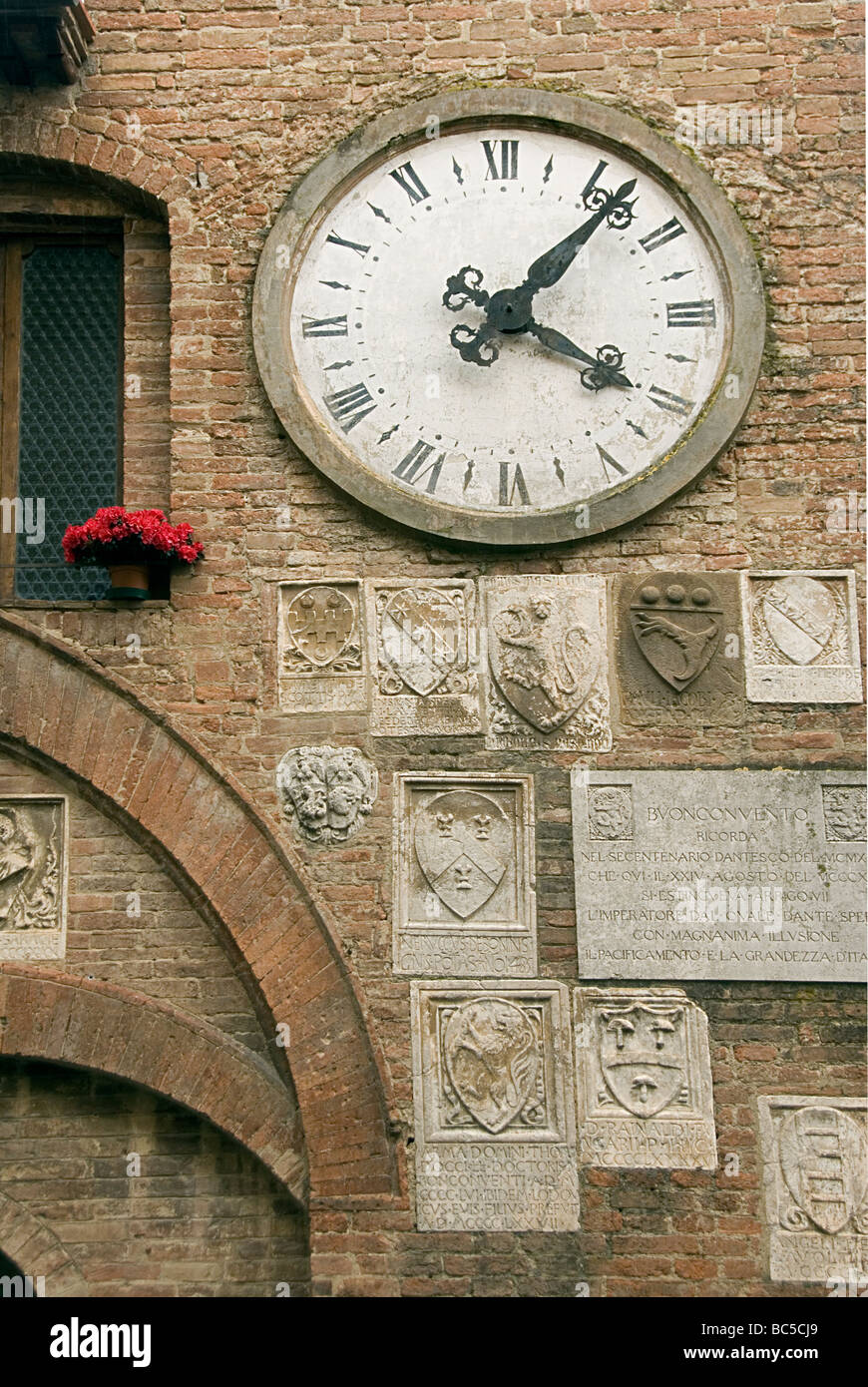 Town clock in Buonconvento in the province of Siena Stock Photo