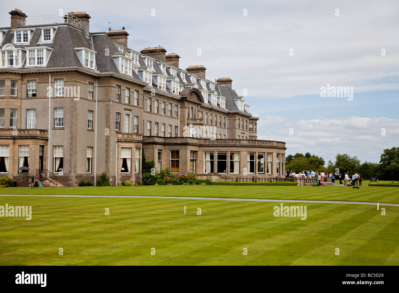 A group of people at a function outside Gleneagles Hotel, the world-famous hotel in Perthshire, Scotland Stock Photo